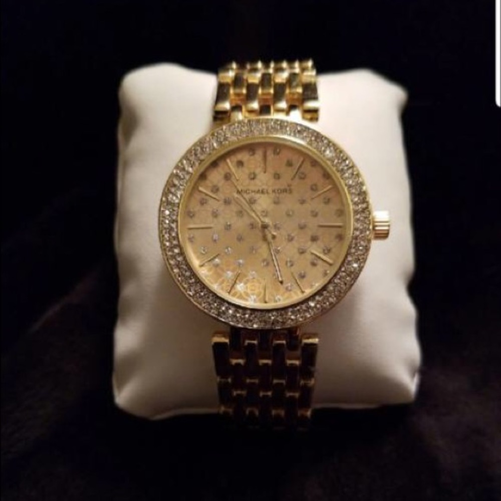 Beautiful golden women’s MK wristwatch